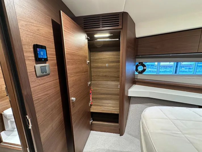 F45110 Yacht Photos Pics Luxurious interior of 2024 Princess F45 yacht with wooden cabinetry and modern design.