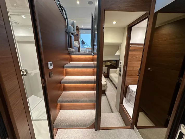 F45110 Yacht Photos Pics Luxurious interior of 2024 Princess F45 yacht with wooden stairs and modern design.