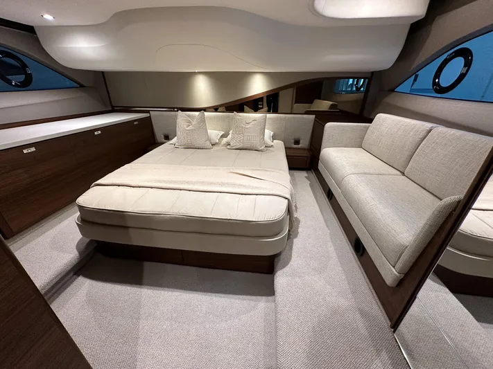 F45110 Yacht Photos Pics Luxurious interior of 2024 Princess F45 yacht with elegant bed and seating area.