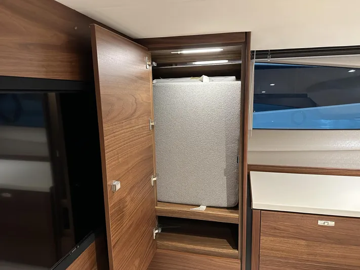 F45110 Yacht Photos Pics 2024 Princess F45 yacht interior with wooden cabinet and storage space.