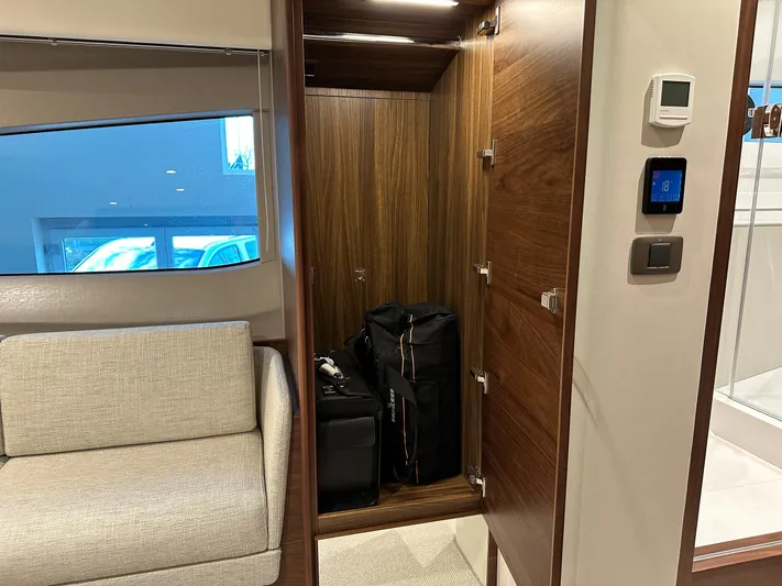 F45110 Yacht Photos Pics Interior of 2024 Princess F45 yacht with open closet and luggage.