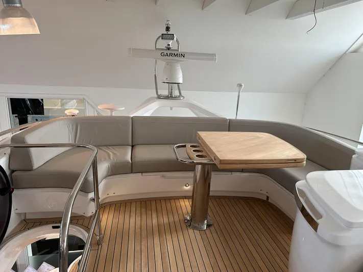 F45110 Yacht Photos Pics Luxurious 2024 Princess F45 yacht interior with elegant seating and wooden flooring.