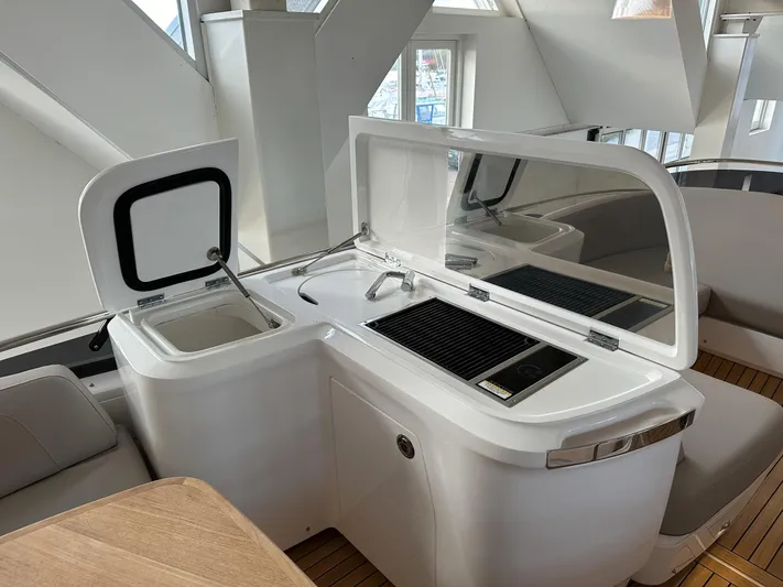 F45110 Yacht Photos Pics Modern kitchen area on 2024 Princess F45 yacht with sleek design and integrated appliances.