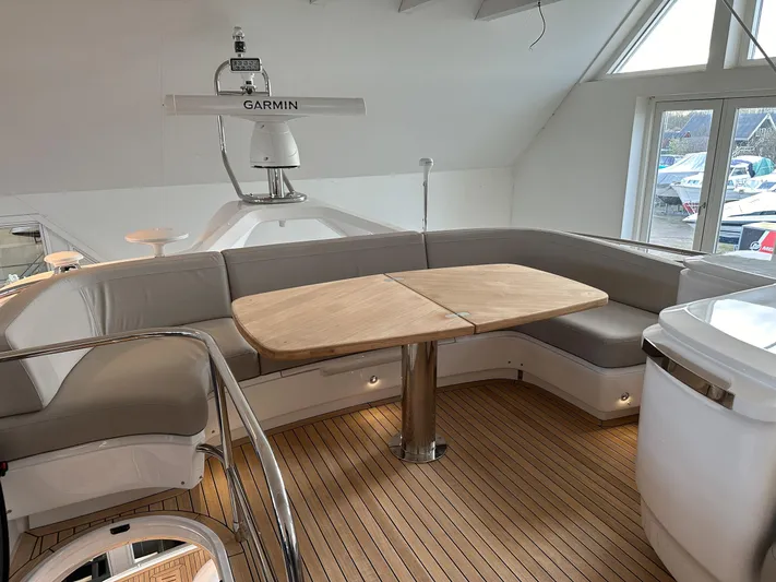 F45110 Yacht Photos Pics Luxurious 2024 Princess F45 yacht interior with elegant seating and wooden table.