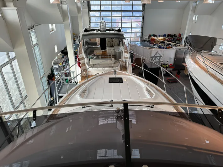 F45110 Yacht Photos Pics 2024 Princess F45 yacht displayed in a showroom, showcasing sleek design and luxury features.