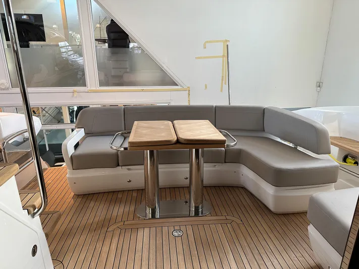 F45110 Yacht Photos Pics Luxurious 2024 Princess F45 yacht interior with elegant seating and wooden flooring.