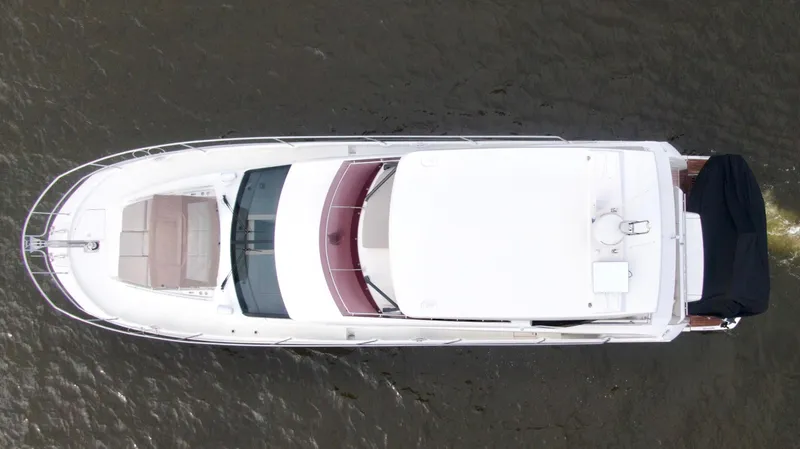  Yacht Photos Pics Aerial view of a 2019 Prestige 520 yacht cruising on water.
