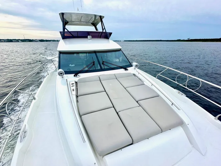  Yacht Photos Pics 2019 Prestige 520 yacht cruising on calm waters with spacious sunbathing deck.
