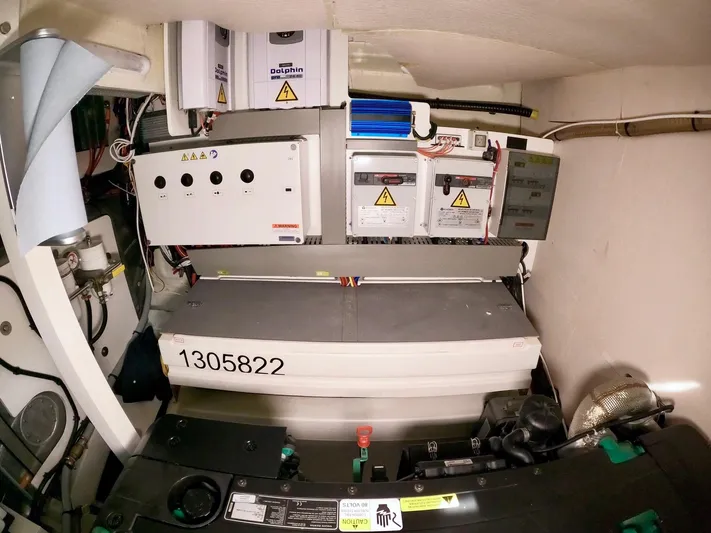  Yacht Photos Pics Engine room of a 2019 Prestige 520 yacht, showcasing electrical systems and components.