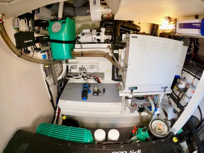  Yacht Photos Pics Engine room of a 2019 Prestige 520 yacht, showcasing complex machinery and equipment.