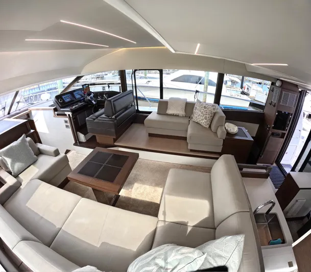  Yacht Photos Pics Luxurious interior of a 2019 Prestige 520 yacht with modern seating and helm station.