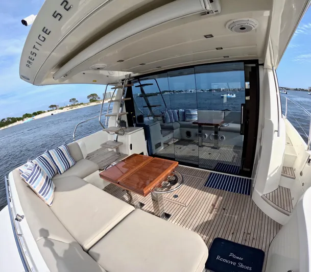  Yacht Photos Pics Luxurious 2019 Prestige 520 yacht with spacious deck and elegant seating area.