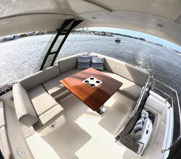  Yacht Photos Pics Luxurious 2019 Prestige 520 yacht with elegant seating and scenic water view.