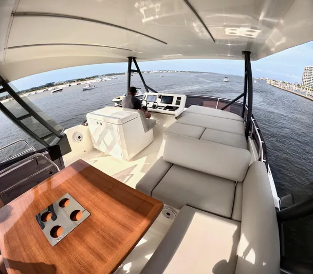  Yacht Photos Pics Luxurious 2019 Prestige 520 yacht interior with helm, seating, and ocean view.