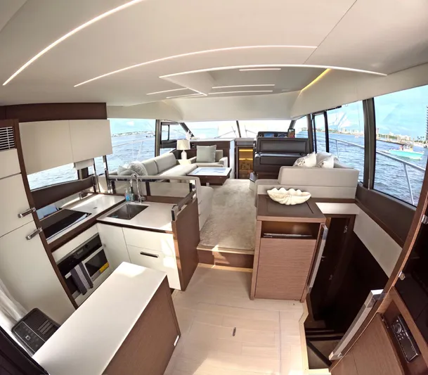  Yacht Photos Pics Luxurious interior of a 2019 Prestige 520 yacht with modern kitchen and seating area.