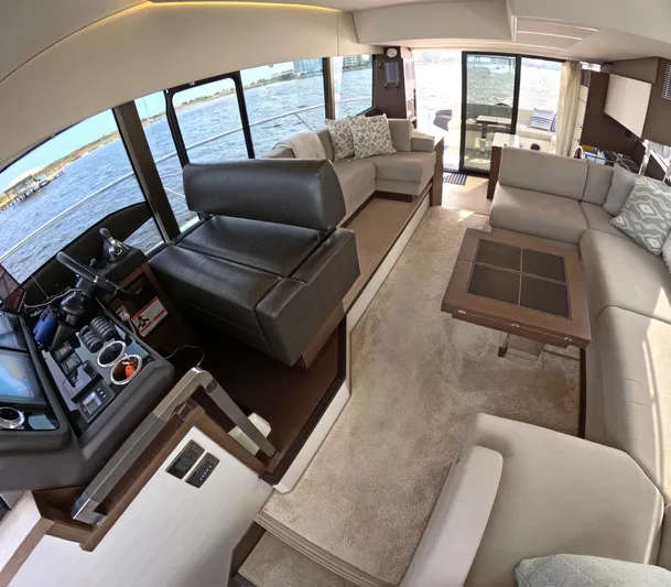  Yacht Photos Pics Luxurious interior of a 2019 Prestige 520 yacht with elegant seating and panoramic windows.