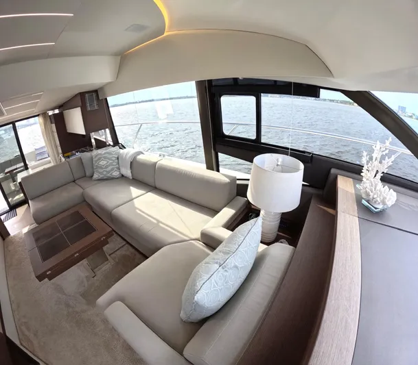  Yacht Photos Pics Luxurious interior of 2019 Prestige 520 yacht with elegant seating and ocean view.
