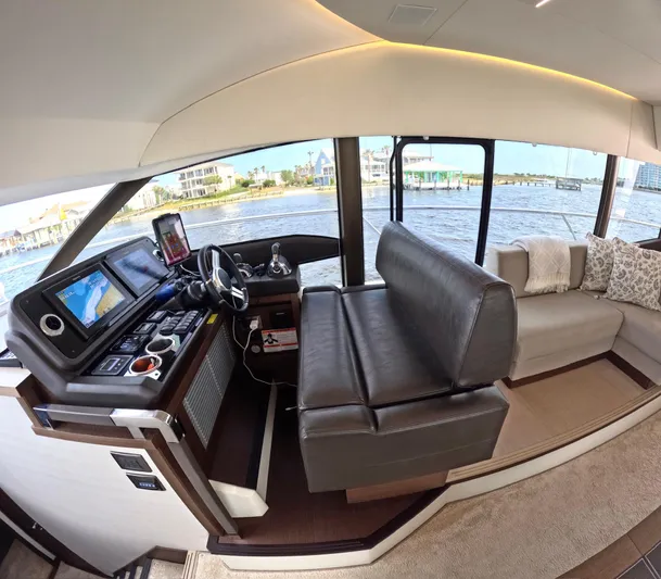  Yacht Photos Pics Luxurious interior of a 2019 Prestige 520 yacht with modern helm and seating.