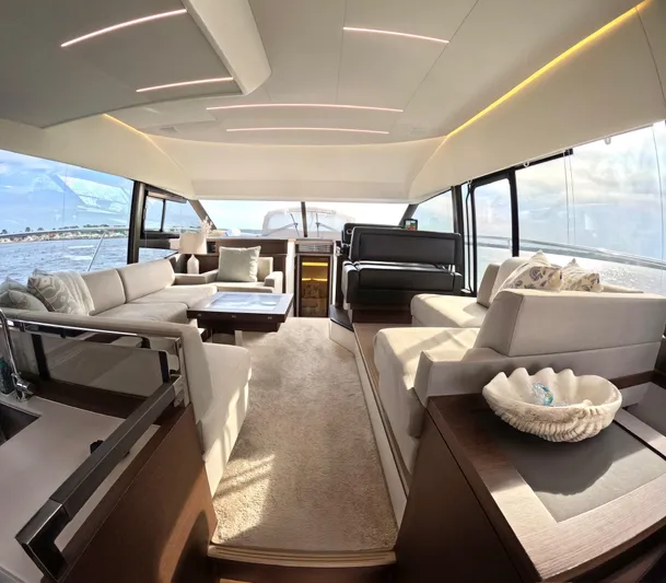  Yacht Photos Pics Luxurious interior of a 2019 Prestige 520 yacht with elegant seating and panoramic windows.