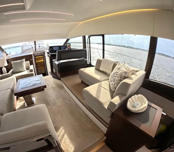  Yacht Photos Pics Luxurious interior of a 2019 Prestige 520 yacht with elegant seating and panoramic windows.