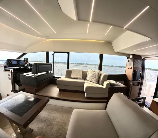  Yacht Photos Pics Luxurious interior of a 2019 Prestige 520 yacht with modern seating and panoramic windows.