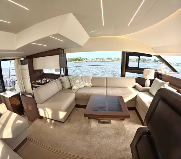  Yacht Photos Pics Luxurious interior of a 2019 Prestige 520 yacht with elegant seating and scenic water view.