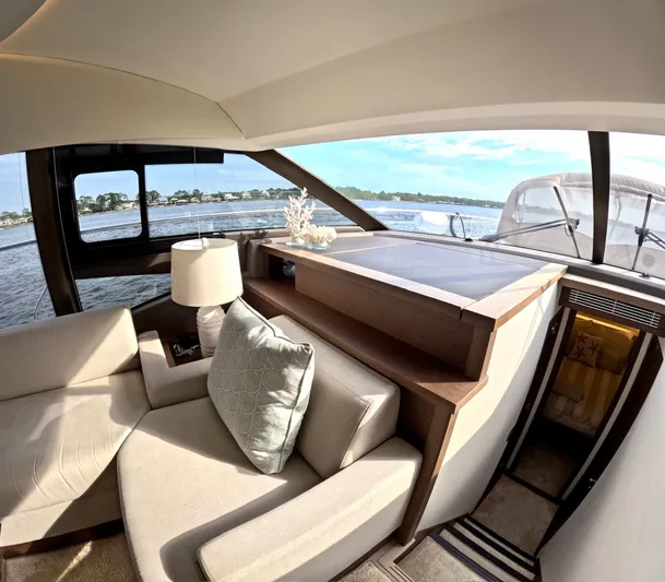  Yacht Photos Pics Luxurious interior of 2019 Prestige 520 yacht with elegant seating and scenic water view.
