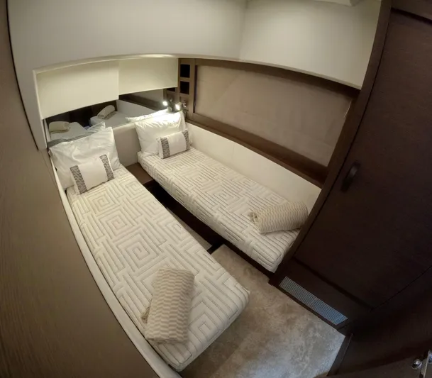  Yacht Photos Pics Luxurious twin cabin interior of 2019 Prestige 520 yacht, featuring elegant bedding and modern design.