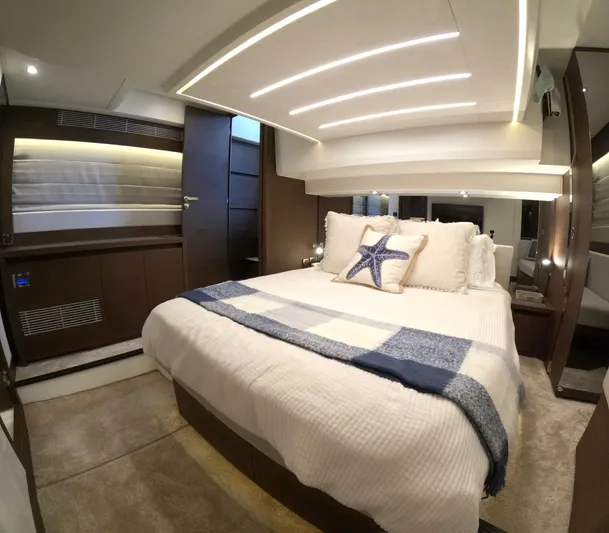  Yacht Photos Pics Luxurious bedroom interior of 2019 Prestige 520 yacht with modern design and cozy bedding.