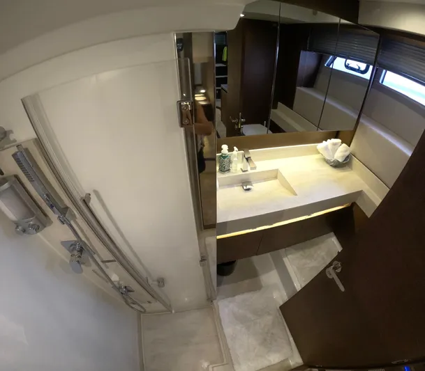  Yacht Photos Pics Luxurious bathroom interior of 2019 Prestige 520 yacht, featuring modern fixtures and elegant design.
