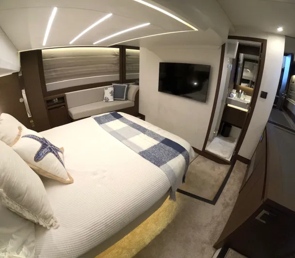  Yacht Photos Pics Luxurious bedroom interior of 2019 Prestige 520 yacht with modern decor and amenities.