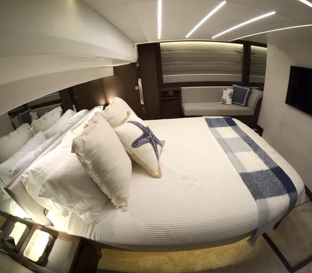  Yacht Photos Pics Luxurious bedroom interior of 2019 Prestige 520 yacht with elegant bedding and modern lighting.