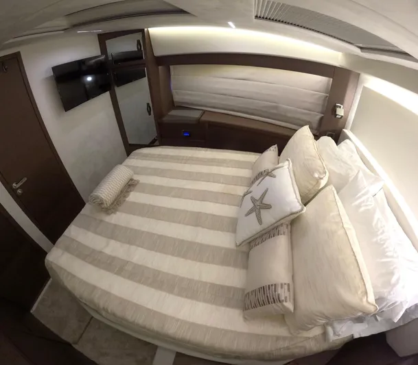  Yacht Photos Pics Luxurious bedroom interior of 2019 Prestige 520 yacht with elegant bedding and modern decor.