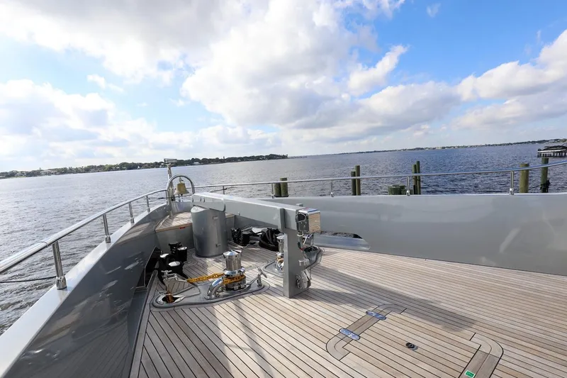  Yacht Photos Pics Majesty 120 yacht deck, 2025 model, overlooking serene waters and blue sky.