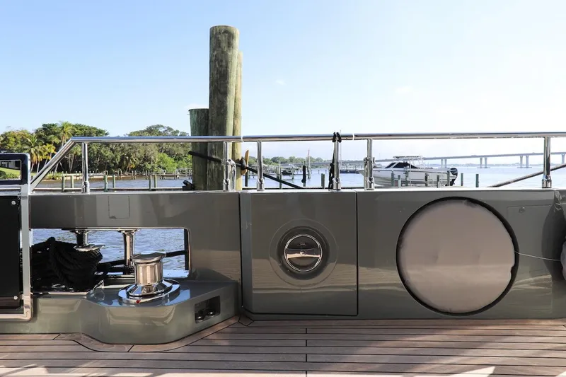  Yacht Photos Pics Majesty 120 yacht deck, 2025 model, docked with scenic waterfront view.