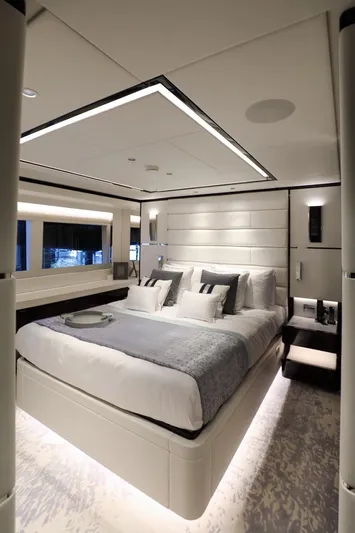  Yacht Photos Pics Luxurious bedroom interior on 2025 Majesty 120 yacht, featuring modern design and elegant lighting.