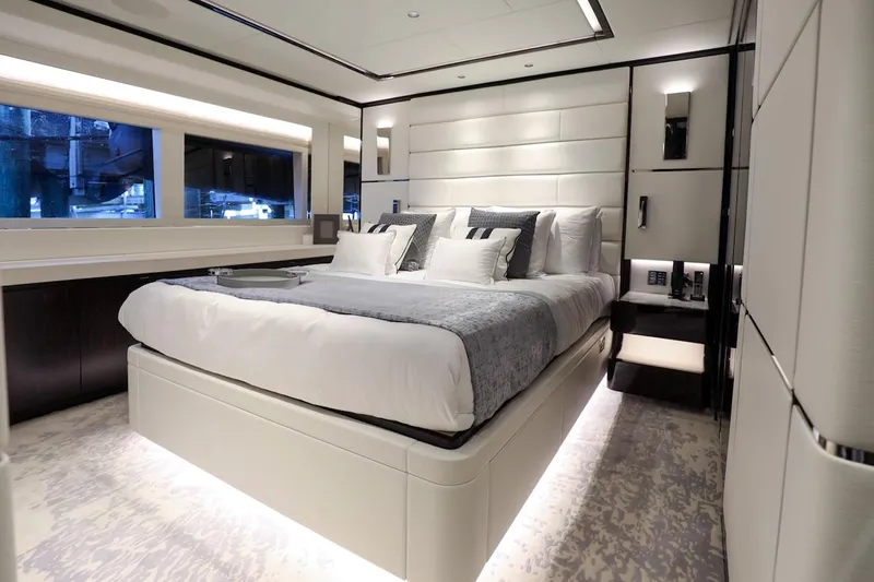  Yacht Photos Pics Luxurious bedroom interior of 2025 Majesty 120 yacht, featuring modern design and elegant furnishings.