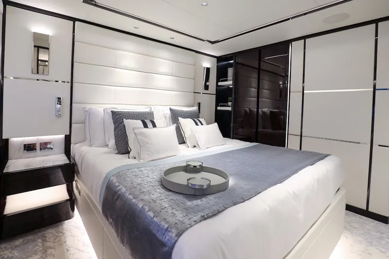  Yacht Photos Pics Luxurious bedroom interior on 2025 Majesty 120 yacht, featuring elegant bedding and modern design.