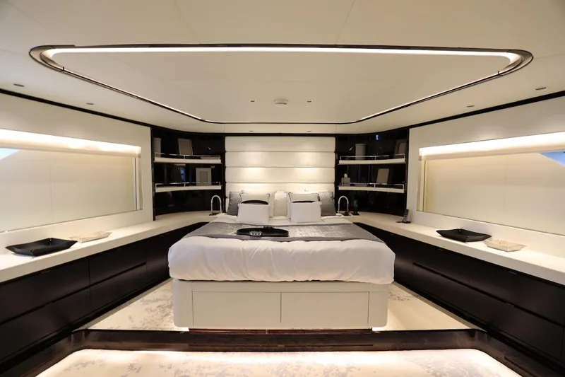  Yacht Photos Pics Luxurious bedroom interior on 2025 Majesty 120 yacht, featuring modern design and ambient lighting.