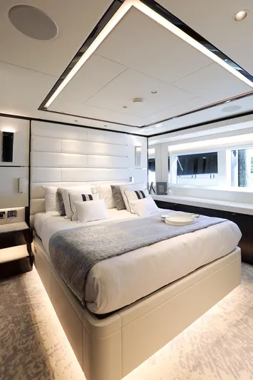  Yacht Photos Pics Luxurious bedroom interior on 2025 Majesty 120 yacht, featuring modern design and elegant furnishings.