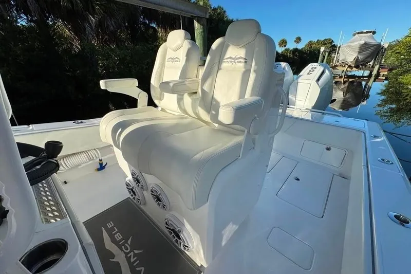  Yacht Photos Pics 2024 Invincible 33 Open Fisherman boat interior with luxurious seating and modern design.