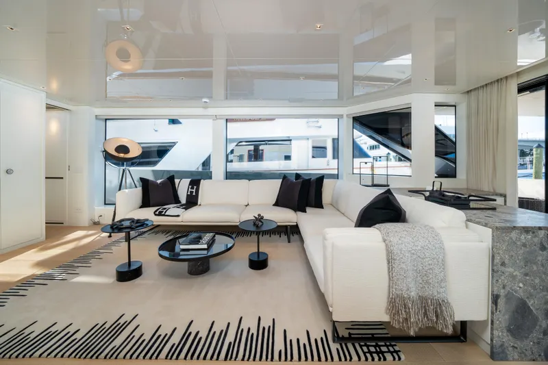 Clic - Sl96a/764 Yacht Photos Pics Luxurious interior of 2022 Sanlorenzo SL96A yacht with modern white sofa and elegant decor.