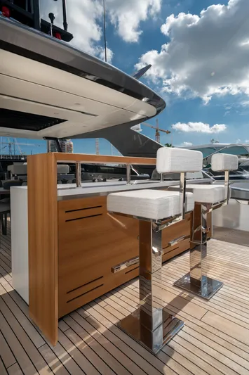 Clic - Sl96a/764 Yacht Photos Pics Luxury Sanlorenzo SL96A yacht deck with modern bar stools, 2022 model.
