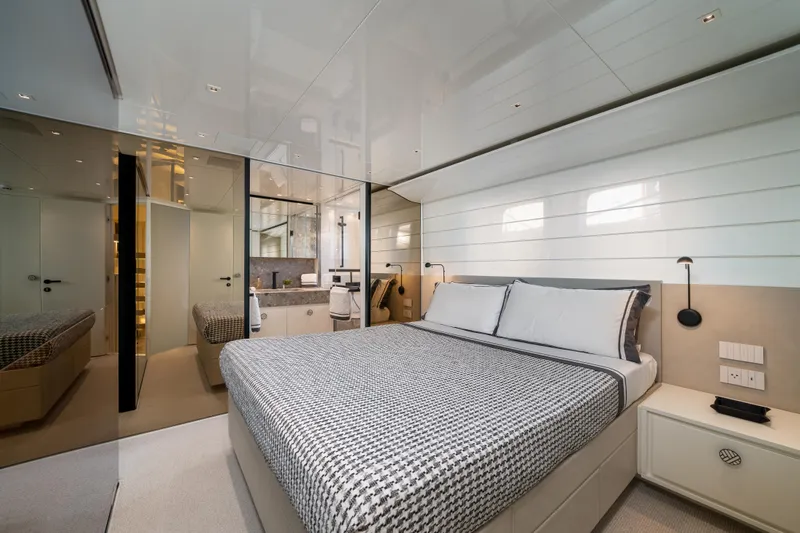 Clic - Sl96a/764 Yacht Photos Pics Luxurious bedroom interior of 2022 Sanlorenzo SL96A yacht with modern design and elegant furnishings.