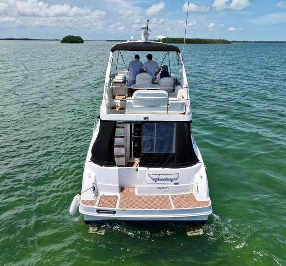  Yacht Photos Pics 2007 Sea Ray 36 Sedan Bridge yacht cruising on open water under a clear sky.