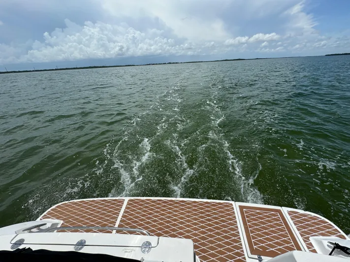  Yacht Photos Pics 2007 Sea Ray 36 Sedan Bridge cruising on open water under cloudy skies.