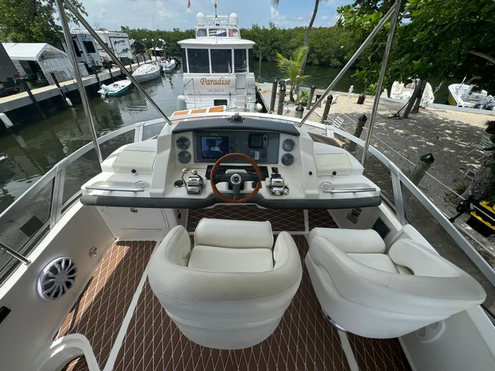  Yacht Photos Pics 2007 Sea Ray 36 Sedan Bridge helm with dual seats, steering wheel, and control panel.