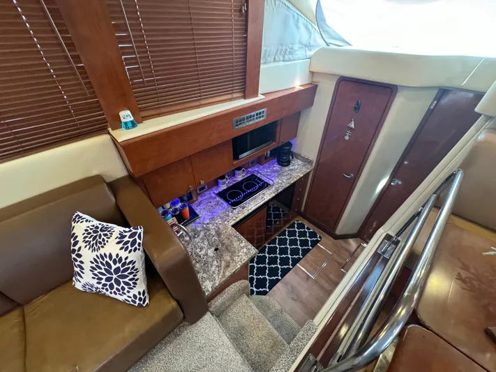  Yacht Photos Pics Interior of 2007 Sea Ray 36 Sedan Bridge with modern kitchen and cozy seating area.