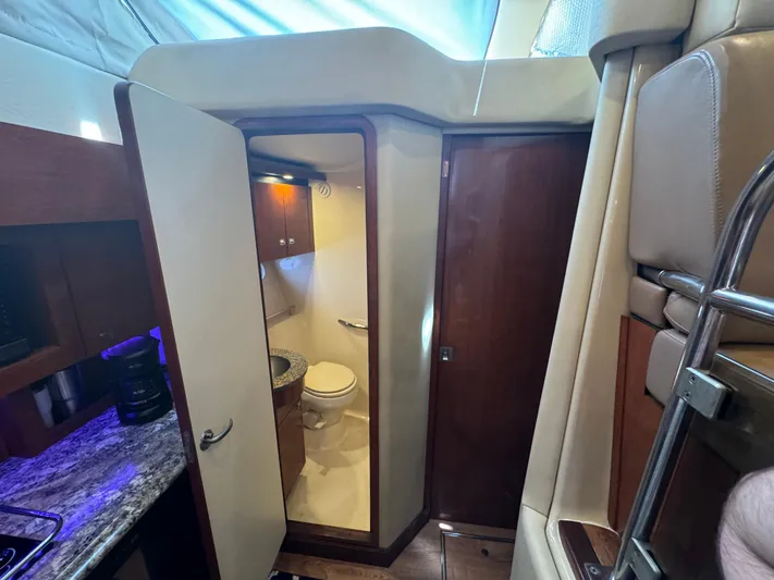  Yacht Photos Pics Interior of 2007 Sea Ray 36 Sedan Bridge showing bathroom and kitchenette area.