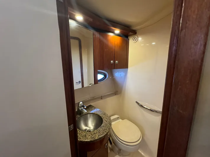  Yacht Photos Pics 2007 Sea Ray 36 Sedan Bridge bathroom with sink, toilet, and wood cabinetry.